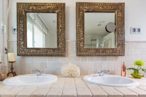 A bathroom at Ocean Views Luxury Villa next to beach