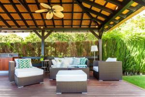 A seating area at Ocean Views Luxury Villa next to beach