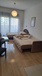 Voodi või voodid majutusasutuse Studio apartment toas