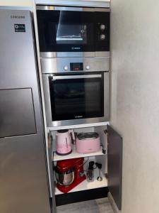 Kuchyň nebo kuchyňský kout v ubytování Comforts apartment 3