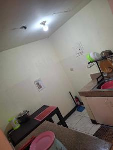 a small kitchen with a sink and a counter at Condotel Cebu City in Cebu City