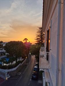 a sunset seen from a balcony of a building at De Angelis Apartments - GOLD in Sant'Agnello +7 photos