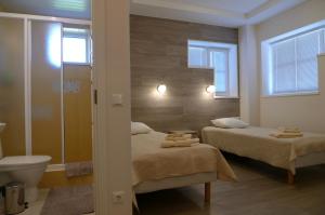Postel nebo postele na pokoji v ubytování Feyena Guesthouse