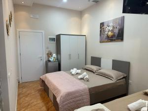 Postel nebo postele na pokoji v ubytování Hotel Osmani