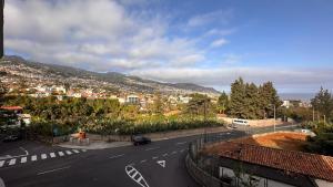 a view of a road with a city in the background at Edna 2 in Funchal +2 photos