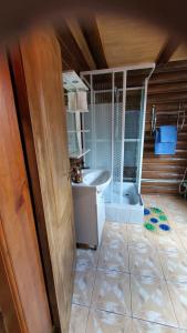 a bathroom with a sink and a bath tub at Relax in Melʼniki