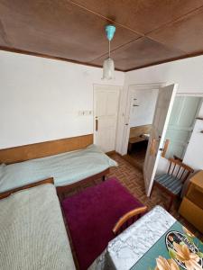 Postel nebo postele na pokoji v ubytování Kosmos