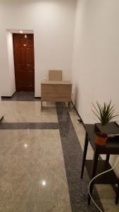 an office with a desk and a chair and a table at Premier Inn Apartments in Budapest