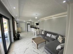 a living room with a couch and a table at Ege Naz 1 in Marmara