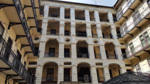 a large building with balconies on the side of it at Premier Inn Apartments in Budapest