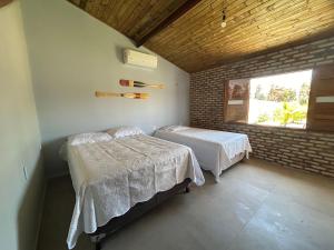 Postel nebo postele na pokoji v ubytování Chalé das Dunas Guajiru
