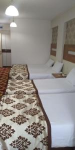 Postel nebo postele na pokoji v ubytování Afyon Grand Arı Hotel
