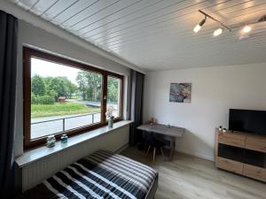TV a/nebo společenská místnost v ubytování Gasthaus Bergmann + 16 fotografií
