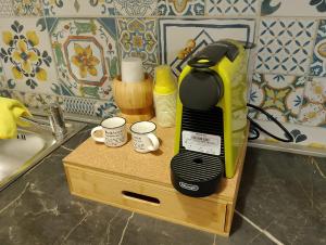 a coffee maker sitting on a counter in a kitchen at Casuzza Nica e Bedda-Centro storico in Palermo