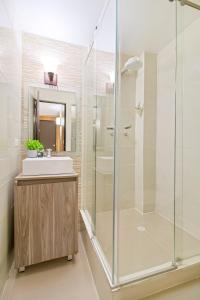 a bathroom with a sink and a shower at 5 Bedroom - 1 Block from Lleras - P2 in Medellín
