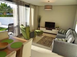a living room with a couch and chairs and a television at Apartment Orihuela Costa Golf 662 in Los Dolses