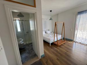 a room with a bed and a mirror in it at Thalassea Apartments in Himare +113 photos