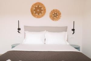 Ένα ή περισσότερα κρεβάτια σε δωμάτιο στο Nisos Mykonos Studio 2