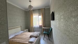 Postel nebo postele na pokoji v ubytování Гостевой дом Мерей