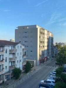 a city street with cars parked in front of a building at Budva in Budva