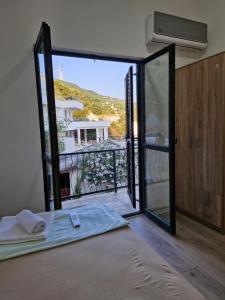 a room with a door open to a balcony at MonaLiza in Ulcinj