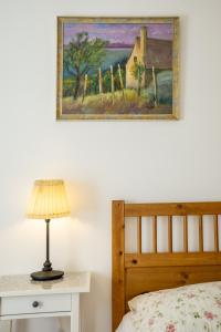 A bed or beds in a room at Sváb Ház