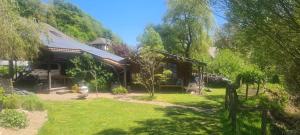 a house in the middle of a yard at Apartment Summer Garden in Trassem