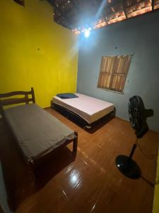 Postel nebo postele na pokoji v ubytování Nossa Casa Temporada