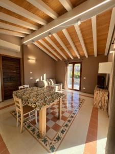 a dining room with a table and chairs at La Madonnina-house in the Bolano vineyard in Bolano