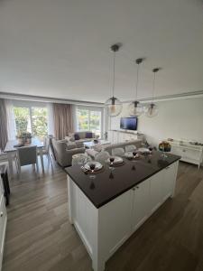 a kitchen and living room with a couch and a table at YeldA in Fethiye