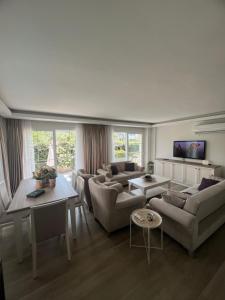 a living room with couches and a table at YeldA in Fethiye