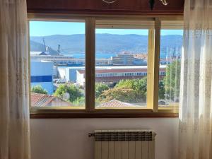 a window with a view of a city at Concepción Arenal 175 in Marín +14 photos