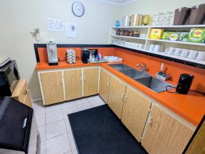 a kitchen with a sink and a counter at Mariner motor hotel in Collingwood +28 photos