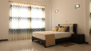 A bed or beds in a room at Ranga Holiday Resort