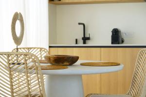 a kitchen with a table with two bowls on it at Balimood Stay in Palanga +15 photos