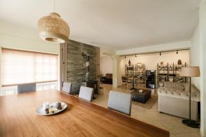 a living room with a wooden table and chairs at Casa do Carril - Private Pool - Douro Valley in Peso da Régua