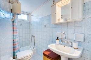a bathroom with a sink and a toilet at MY ZEN Chios in Chios +5 photos