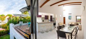 a kitchen and living room with a table and chairs at El paraiso en Melgar in Melgar