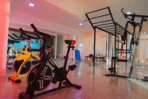 a gym with a exercise bike and a treadmill at Hotel ACA Chilecito in Chilecito +40 photos