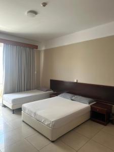 Postel nebo postele na pokoji v ubytování Ellis Hotel Apartments