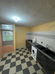 Kuchyň nebo kuchyňský kout v ubytování Appartement paisible en colocation
