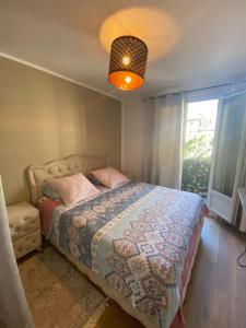 Ένα ή περισσότερα κρεβάτια σε δωμάτιο στο Magnifique chambre paris