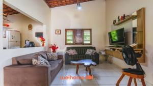 TV a/nebo společenská místnost v ubytování Casa em Passo de Camaragibe perto da praia + 34 fotografií