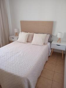 Ένα ή περισσότερα κρεβάτια σε δωμάτιο στο Formentera Suite 3