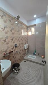 a bathroom with a sink and a toilet at Varanasi Nest in Varanasi