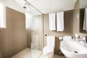 a bathroom with a toilet and a sink at Haus Studio's in Hahndorf +36 photos