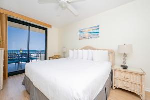 a bedroom with a large bed with a view of the ocean at Phoenix X 212 condo in Orange Beach +38 photos