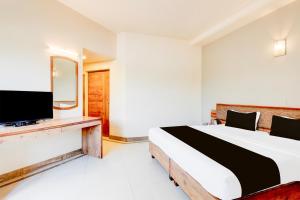 TV a/nebo společenská místnost v ubytování Hotel O Ratna Regency