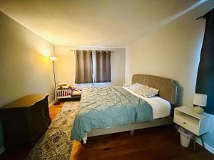 a small bedroom with a bed and a window at Family-Friendly Home Near Sesame Place 2 King Beds in Morrisville