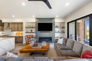 a living room with a couch and a fireplace at Pagoda Peaks - Modern Luxury Near Bozeman Beach in Bozeman +61 photos